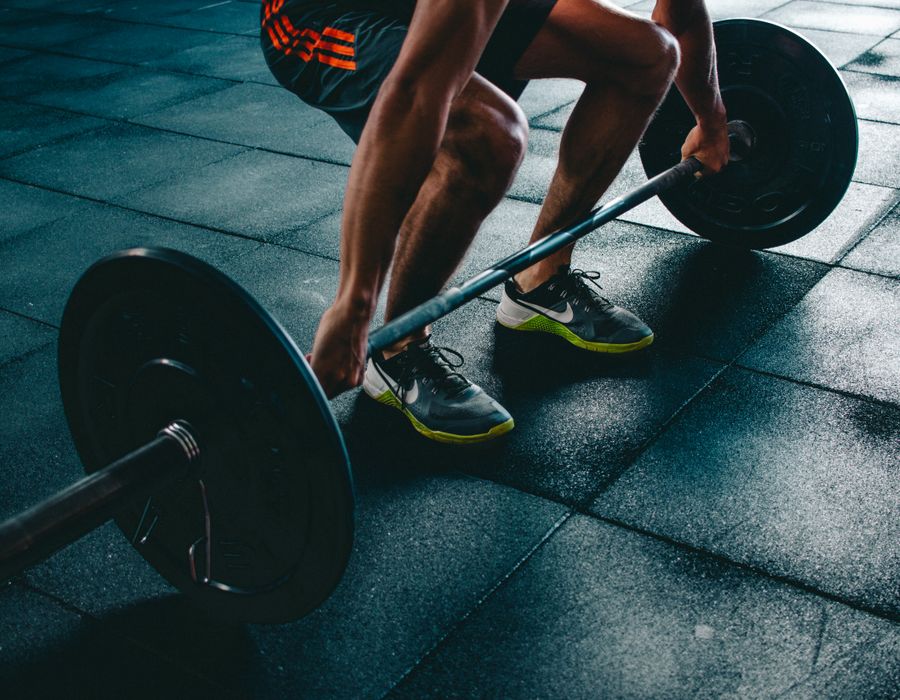 Athlete loading a barbell